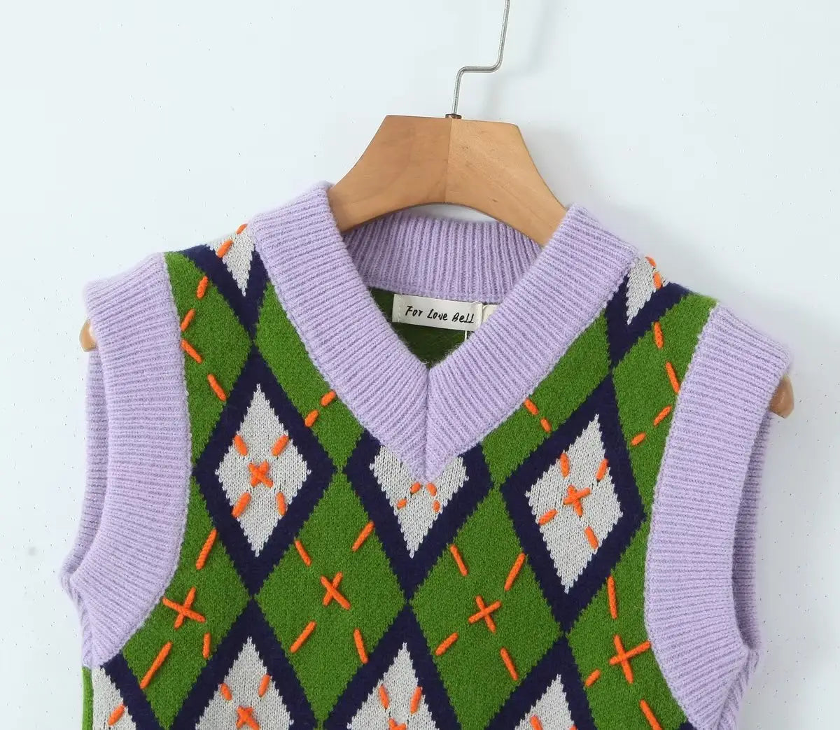 Chaleco tipo suéter corto de rombos verde y lila